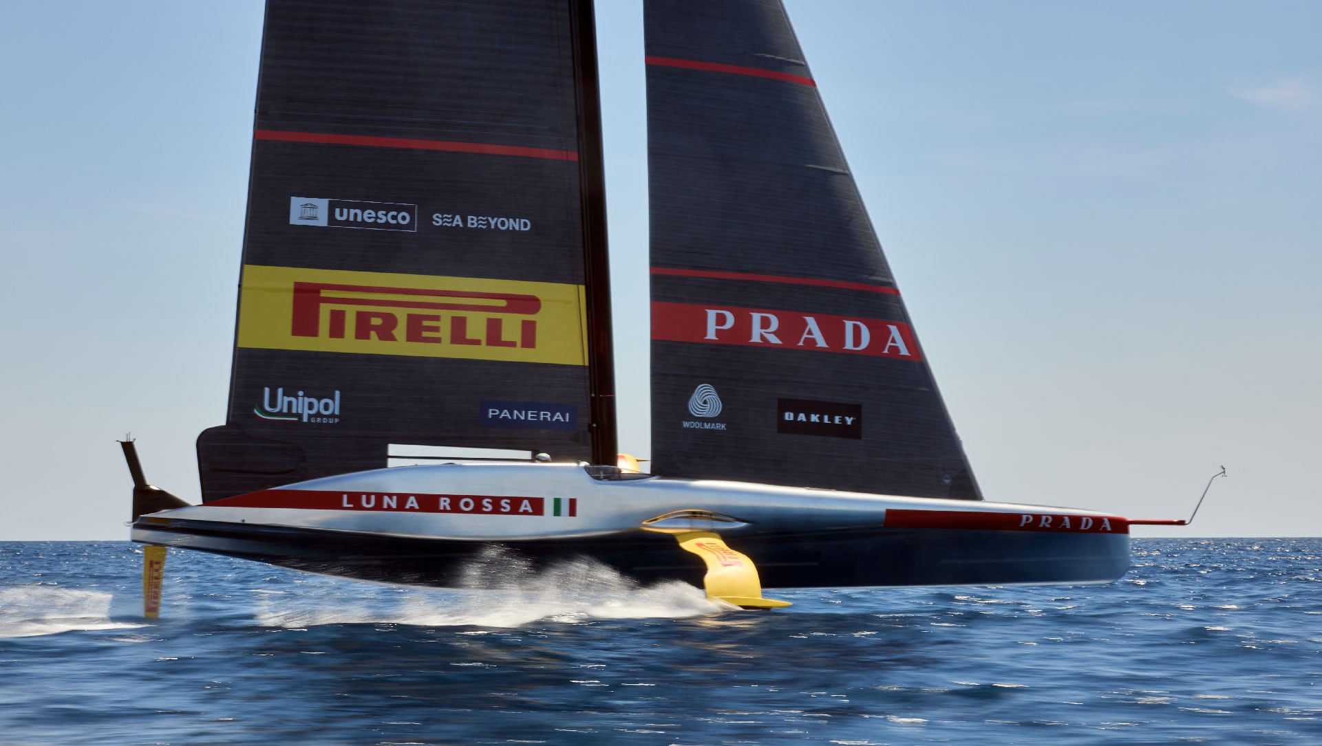 Luna Rossa’s silver AC75 foiling at speed, photographed by Carlo Borlenghi